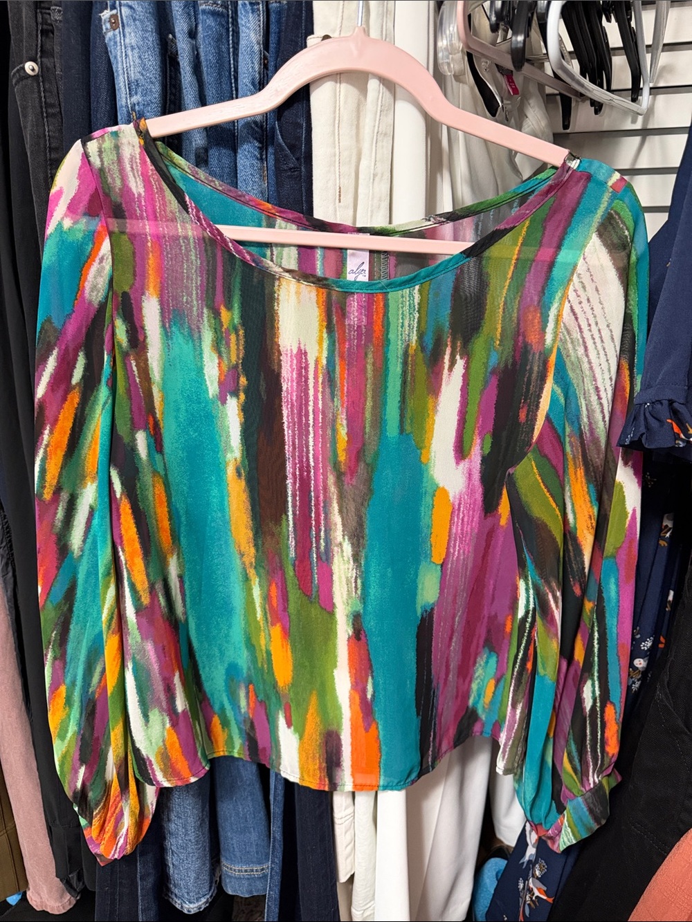 colorful top with buttons down the back